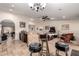 Open-concept space showing the kitchen and living room, with the stone-clad kitchen island taking center stage at 5616 E Desert Vista Trl, Cave Creek, AZ 85331