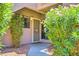 Charming home entrance with a secure door, lush greenery, and a welcoming walkway at 5950 N 78Th St # 102, Scottsdale, AZ 85250