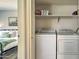 Convenient laundry area with modern appliances next to a bedroom providing ease of use at 5950 N 78Th St # 102, Scottsdale, AZ 85250