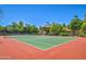 Well-maintained community tennis court surrounded by trees and lush landscaping at 5950 N 78Th St # 102, Scottsdale, AZ 85250