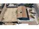Aerial view of a single-story home with a large, empty lot and a neutral-toned roof at 6033 S 19Th Pl, Phoenix, AZ 85042