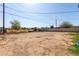 The large dirt backyard has block fencing at 6033 S 19Th Pl, Phoenix, AZ 85042