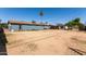 Large dirt backyard, with block fencing, and single story house at 6033 S 19Th Pl, Phoenix, AZ 85042