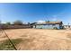 Large dirt backyard with a single story house in the background at 6033 S 19Th Pl, Phoenix, AZ 85042