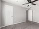 Bedroom with neutral walls, carpet, and closet, offering a blank canvas for personalization at 6033 S 19Th Pl, Phoenix, AZ 85042