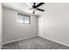 This bedroom has neutral carpet and paint, a ceiling fan, and a single-door closet at 6033 S 19Th Pl, Phoenix, AZ 85042