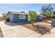 Blue single-story house featuring a well-kept front yard, concrete driveway, and easy access to the entrance at 6033 S 19Th Pl, Phoenix, AZ 85042
