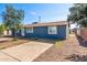Single-story home with a blue exterior, a convenient driveway, and low-maintenance landscaping for easy upkeep at 6033 S 19Th Pl, Phoenix, AZ 85042