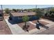 Charming blue single-story home with xeriscaped front yard, sidewalks, and a well-maintained lawn at 6033 S 19Th Pl, Phoenix, AZ 85042