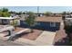 Picture of a blue single-story home with a xeriscaped front yard, and concrete driveway at 6033 S 19Th Pl, Phoenix, AZ 85042