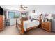 Bedroom featuring a large window offering plenty of natural light and a ceiling fan at 6528 S 258Th Dr, Buckeye, AZ 85326