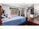 Bedroom with a large window offering plenty of natural light and neutral wall paint at 6528 S 258Th Dr, Buckeye, AZ 85326