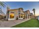 Spacious backyard featuring concrete patio with artificial turf and drought-resistant landscaping at 668 S Catalina St, Gilbert, AZ 85233