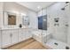 Beautiful bathroom boasts a soaking tub, glass-enclosed shower, and double sinks for a spa-like experience at 668 S Catalina St, Gilbert, AZ 85233