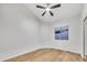 Bright and airy bedroom with a ceiling fan and large window at 668 S Catalina St, Gilbert, AZ 85233