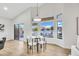 Dining area with a modern table set, ample natural light, and access to the backyard patio at 668 S Catalina St, Gilbert, AZ 85233