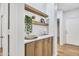 Stylish entryway features floating shelves and ample cabinet space at 668 S Catalina St, Gilbert, AZ 85233