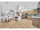 Open-concept living space with a modern kitchen, dining area, and cozy living room at 668 S Catalina St, Gilbert, AZ 85233