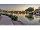 Scenic neighborhood pond and landscaping enhance this community at 668 S Catalina St, Gilbert, AZ 85233