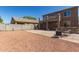 Large backyard featuring a spacious patio, gravel landscaping, and an upper level balcony at 6746 W Wethersfield Rd, Peoria, AZ 85381