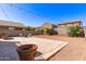 Paver patio with string lights and gravel landscaping, perfect for outdoor living at 6746 W Wethersfield Rd, Peoria, AZ 85381