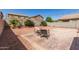 Backyard with patio, gravel landscaping, string lights and inviting outdoor seating at 6746 W Wethersfield Rd, Peoria, AZ 85381