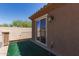 Private balcony with astroturf flooring and stucco walls, offering outdoor relaxation at 6746 W Wethersfield Rd, Peoria, AZ 85381