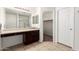 Bathroom features a vanity, shower and walk-in closet at 6746 W Wethersfield Rd, Peoria, AZ 85381