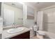 Bathroom features a neutral vanity, framed mirror and shower-tub combo at 6746 W Wethersfield Rd, Peoria, AZ 85381