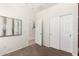 Carpeted bedroom featuring an open doorway and mirrored closet doors at 6746 W Wethersfield Rd, Peoria, AZ 85381