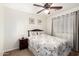 Bedroom features a ceiling fan and neutral walls at 6746 W Wethersfield Rd, Peoria, AZ 85381