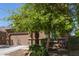 Inviting two-story house with desert landscaping with a two-car garage at 6746 W Wethersfield Rd, Peoria, AZ 85381
