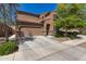 Inviting two-story home featuring a two-car garage, landscaped yard, and charming desert landscaping at 6746 W Wethersfield Rd, Peoria, AZ 85381