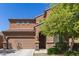 Charming two-story home with desert landscaping featuring a two-car garage at 6746 W Wethersfield Rd, Peoria, AZ 85381