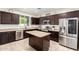 Well-equipped kitchen with stainless steel appliances, granite countertops, and ample cabinet space at 6746 W Wethersfield Rd, Peoria, AZ 85381