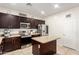 Modern kitchen featuring granite countertops, stainless steel appliances, and ample storage at 6746 W Wethersfield Rd, Peoria, AZ 85381