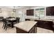 Open kitchen and dining area with stainless steel appliances and natural light at 6746 W Wethersfield Rd, Peoria, AZ 85381