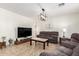 Cozy living room featuring comfortable seating and modern decor at 6746 W Wethersfield Rd, Peoria, AZ 85381