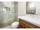 Well lit bathroom featuring a step-in shower with glass door and grab bar, modern vanity and stylish fixtures at 6831 S Coral Gable Dr, Chandler, AZ 85249