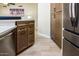 Modern kitchen featuring stainless steel appliances, wooden cabinets, and stylish countertops at 6831 S Coral Gable Dr, Chandler, AZ 85249