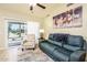 Comfortable living room featuring tile floors, a vaulted ceiling, and sliding glass doors at 6831 S Coral Gable Dr, Chandler, AZ 85249
