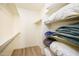 Bright walk-in closet with built-in shelving, providing ample storage space for an organized wardrobe at 6831 S Coral Gable Dr, Chandler, AZ 85249
