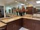 Spacious bathroom featuring double sinks, granite countertops, and ample storage space at 7272 E Gainey Ranch Rd # 121, Scottsdale, AZ 85258