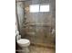 Tile shower featuring a window and grab bar at 7272 E Gainey Ranch Rd # 121, Scottsdale, AZ 85258