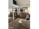 Bedroom featuring a large dresser, mirrored closet doors, and comfortable seating area at 7272 E Gainey Ranch Rd # 121, Scottsdale, AZ 85258