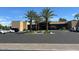 Clubhouse parking area with well-maintained landscaping, ample parking and modern architecture at 7272 E Gainey Ranch Rd # 121, Scottsdale, AZ 85258