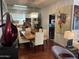 Open-concept dining room with modern chandelier and hardwood flooring at 7272 E Gainey Ranch Rd # 121, Scottsdale, AZ 85258