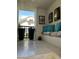 Covered front porch with bench seating, pillows, and potted plants at 7272 E Gainey Ranch Rd # 121, Scottsdale, AZ 85258