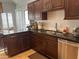 The kitchen features wood cabinetry, granite countertops and stainless steel appliances at 7272 E Gainey Ranch Rd # 121, Scottsdale, AZ 85258
