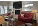Bright living room with modern fireplace and stylish decor at 7272 E Gainey Ranch Rd # 121, Scottsdale, AZ 85258